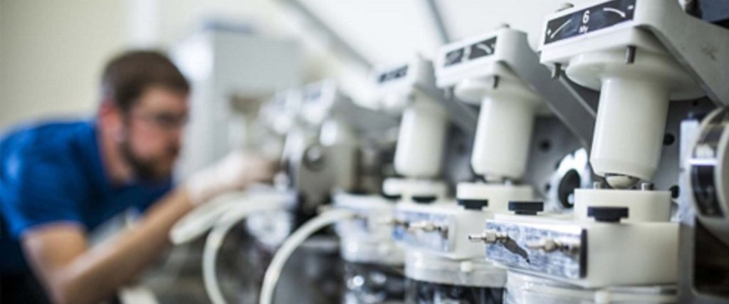 Lab technicians working on medical equipments