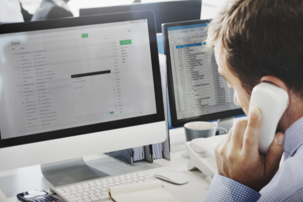 An office personnel answering a phone call